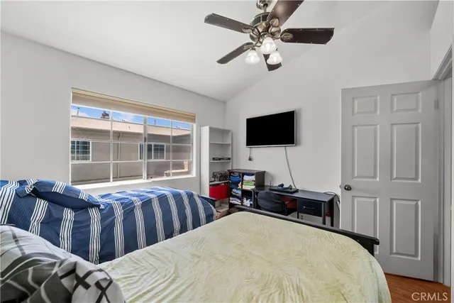 a bedroom with a bed and a book shelf