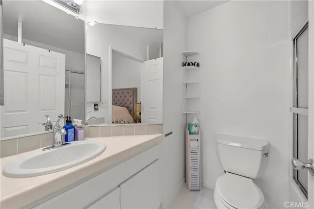 a bathroom with a glass shower door