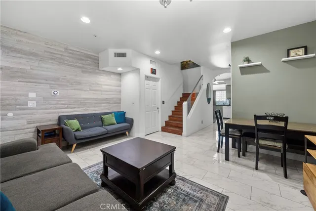 a view of a kitchen with fridge and a sink