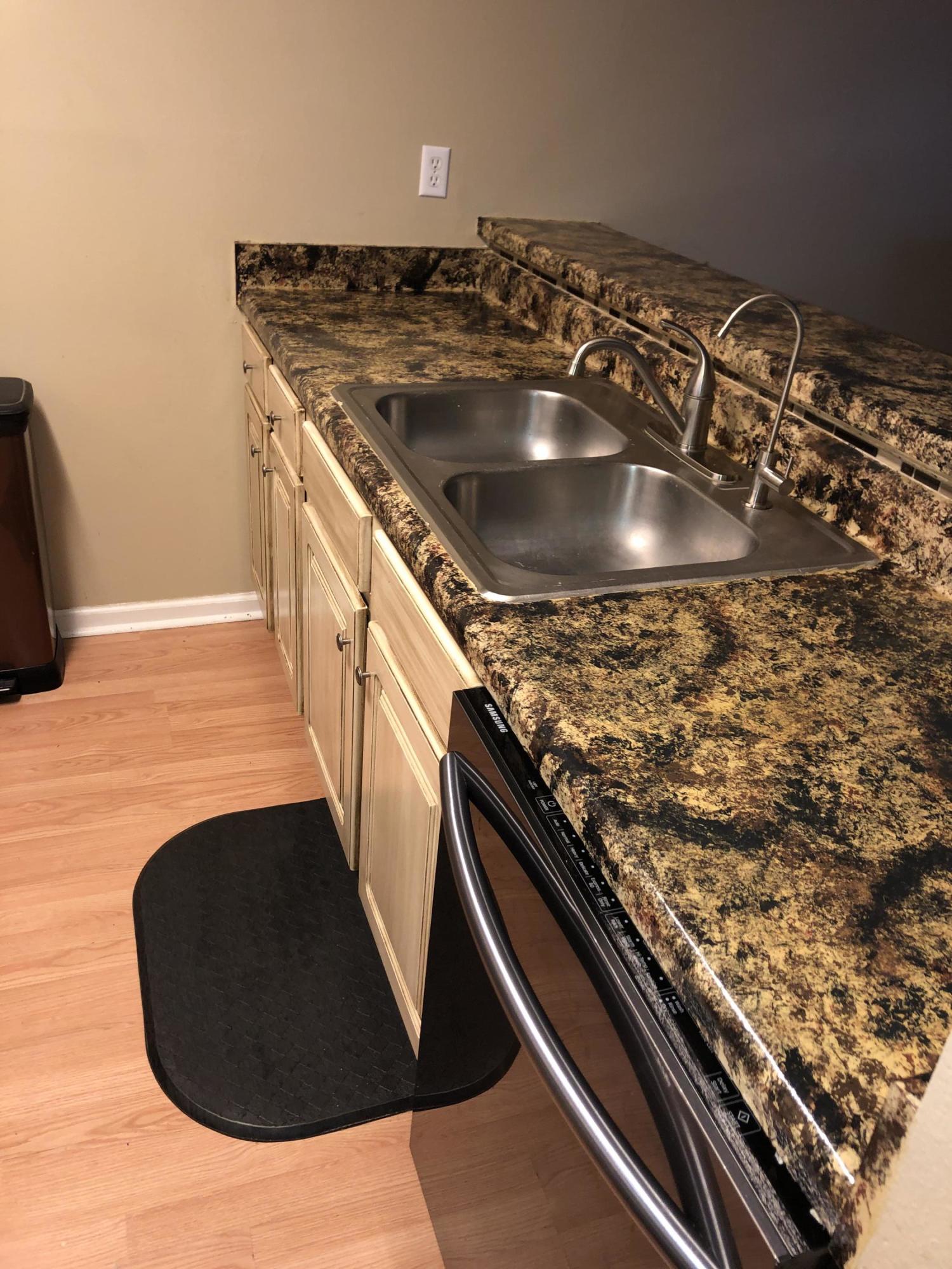 506 Keystone Road Mary Esther, FL 32569 - Photo 13 of 17 a kitchen with a stove and a sink