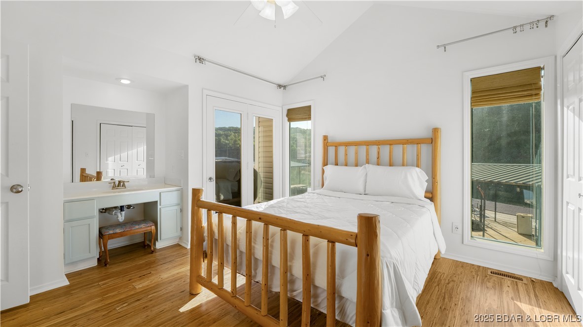 1145 & Lots 46 56 Camp Branch Road Sunrise Beach, MO 65079 - Photo 12 of 37 Primary with bath attached and extra vanity in bed