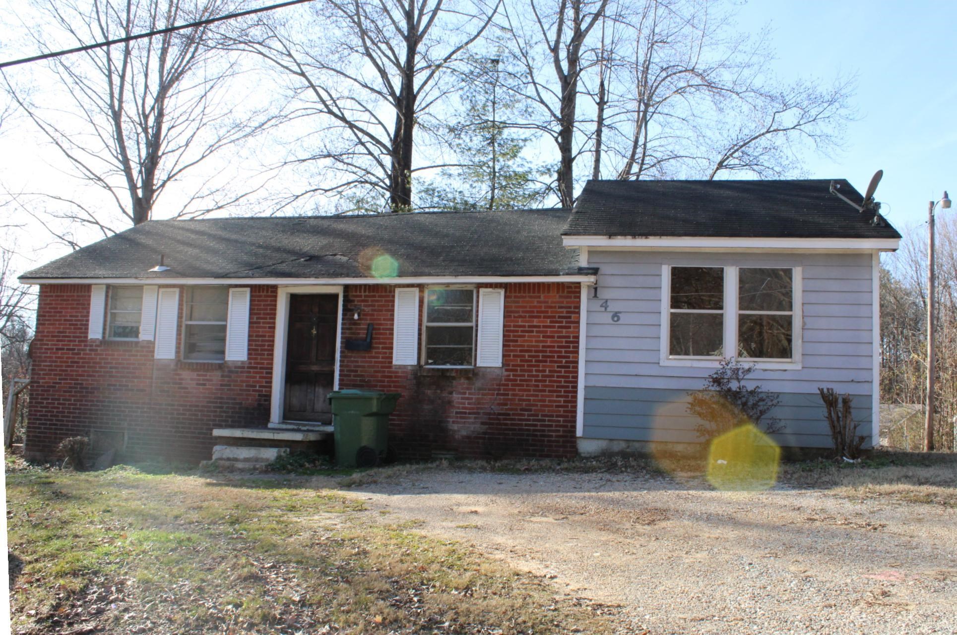 146 Center Street Ripley, TN 38063 - Photo 1 of 18 a front view of a house with patio