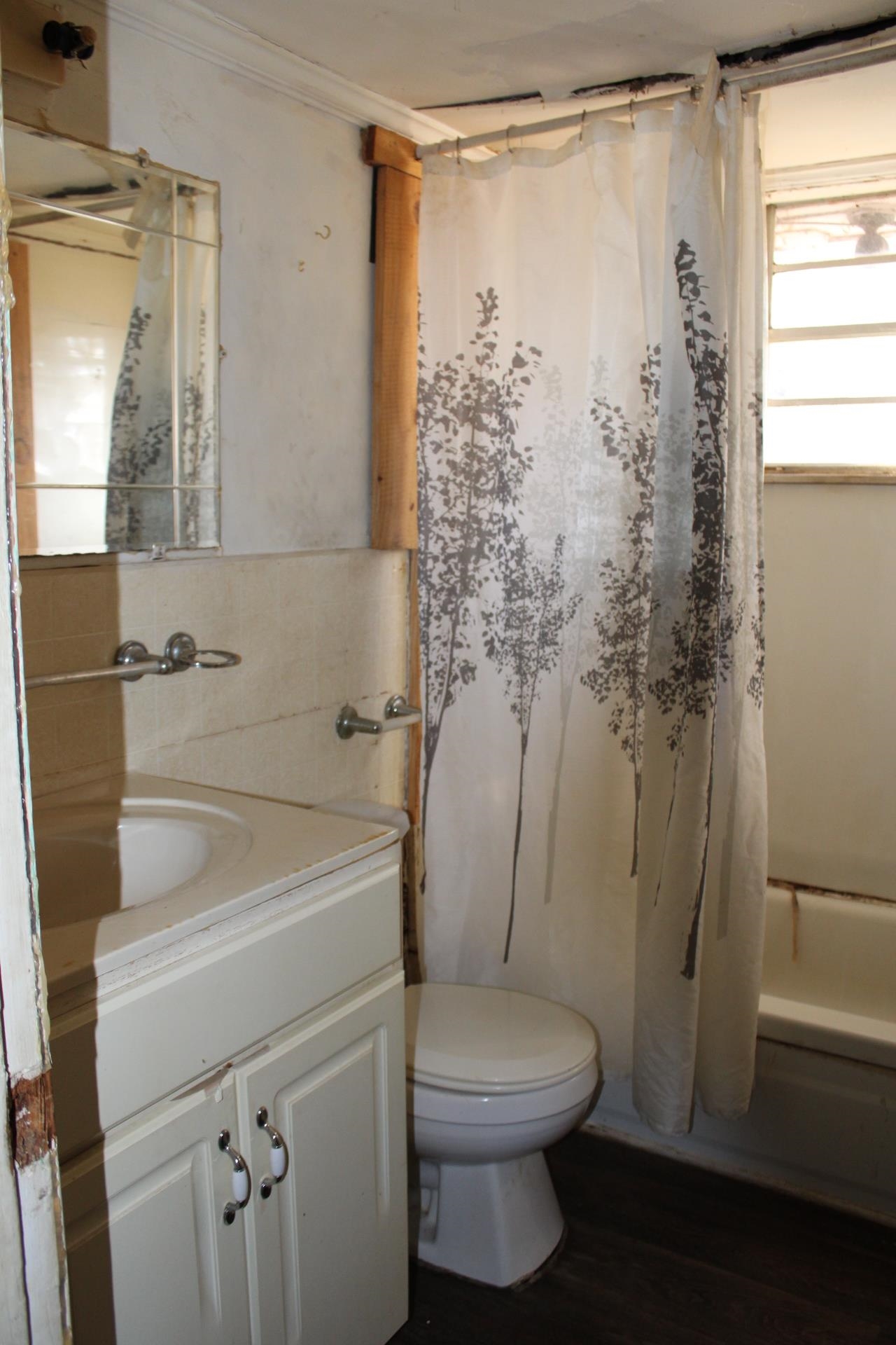 146 Center Street Ripley, TN 38063 - Photo 11 of 18 a bathroom with a shower a toilet and a window