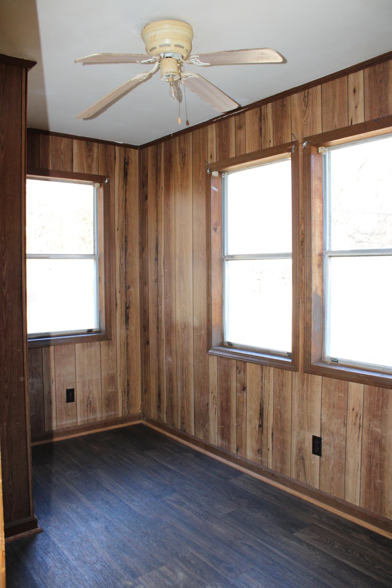 146 Center Street Ripley, TN 38063 - Photo 14 of 18 a view of an empty room with a window and wooden floor