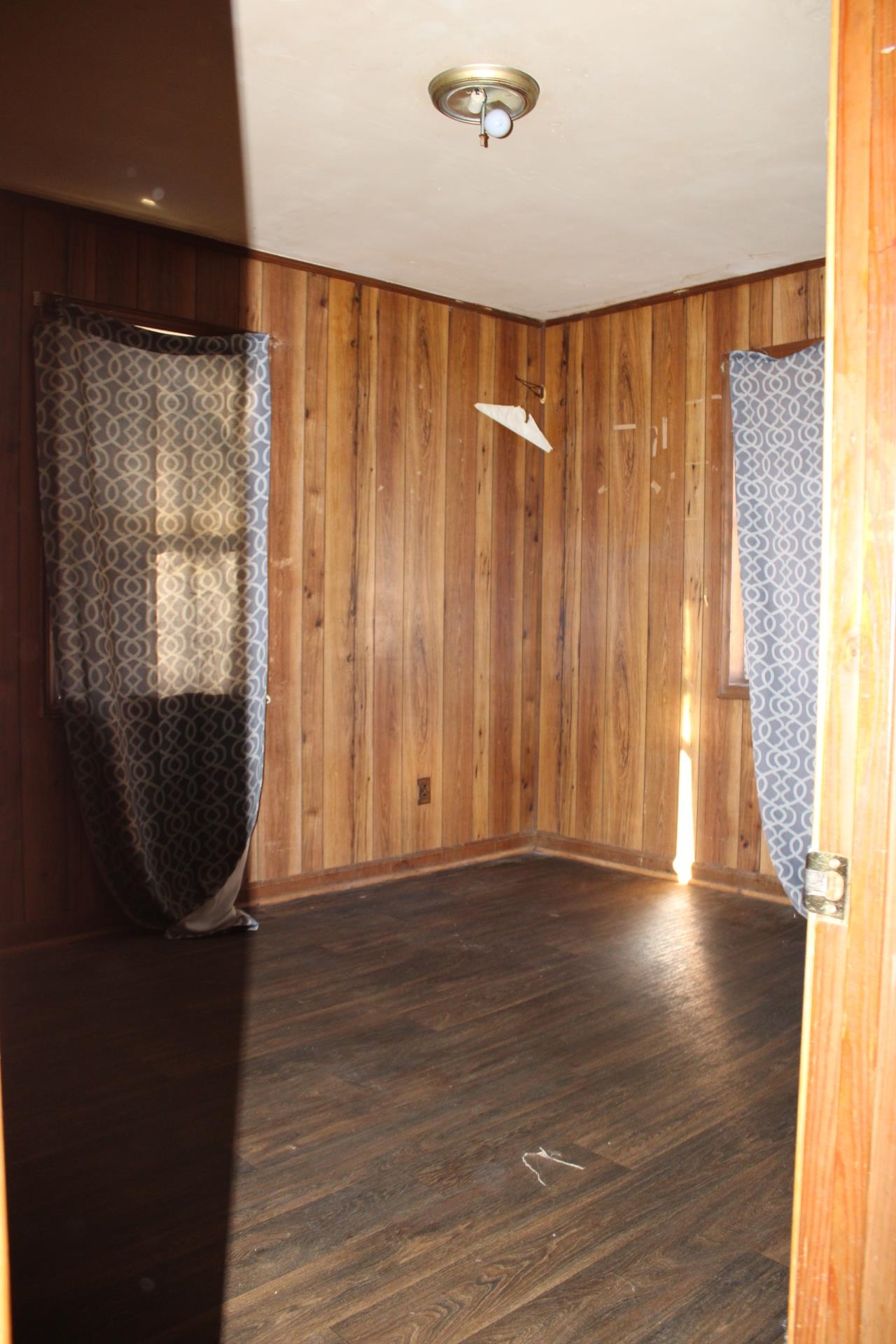 146 Center Street Ripley, TN 38063 - Photo 15 of 18 a view of a room with wooden floor and windows