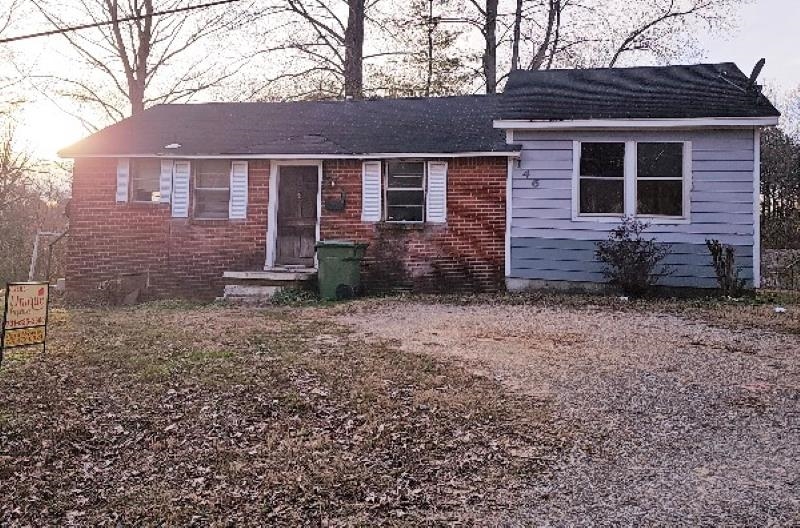 146 Center Street Ripley, TN 38063 - Photo 17 of 18 a view of a brick house with a yard and wooden fence