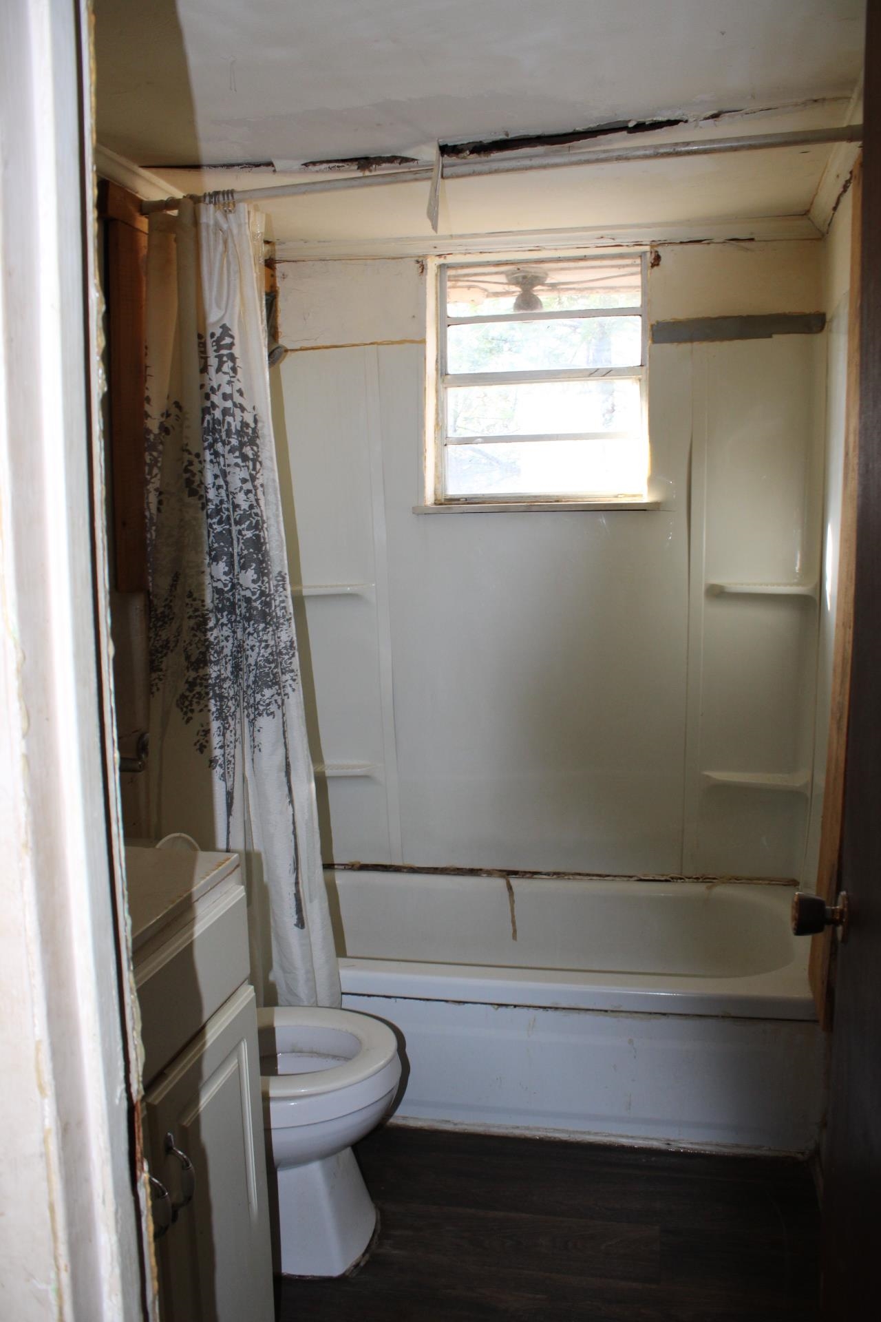 146 Center Street Ripley, TN 38063 - Photo 10 of 18 a bathroom with a toilet and a shower
