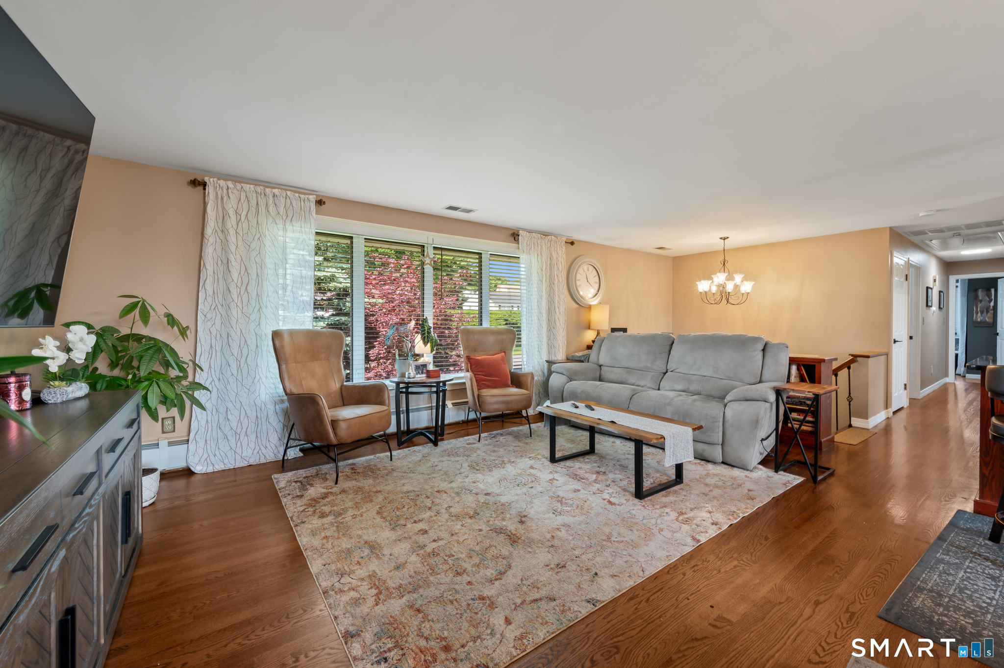 201 Ridge Crest Circle Wethersfield, CT 06109 - Photo 8 of 35 a living room with furniture and a wooden floor