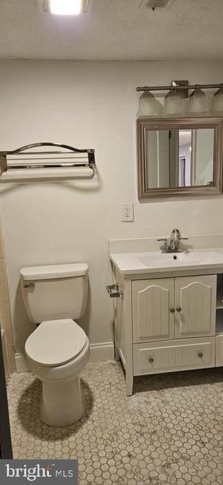44693 White Oak Court, Unit 2B California, MD 20619 - Photo 11 of 14 a bathroom with a sink toilet and mirror