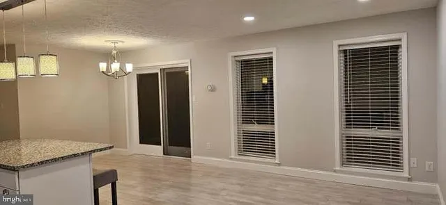 a view of a livingroom with a kitchen