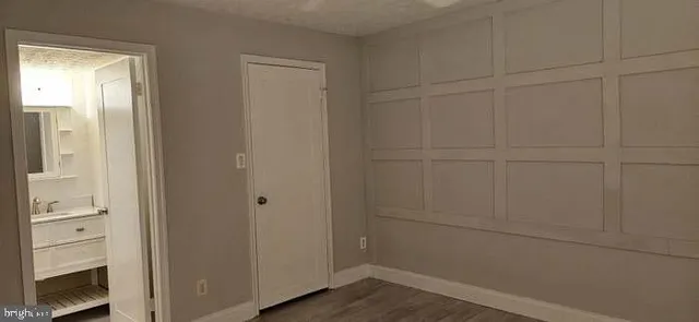 a bathroom with a sink toilet and mirror