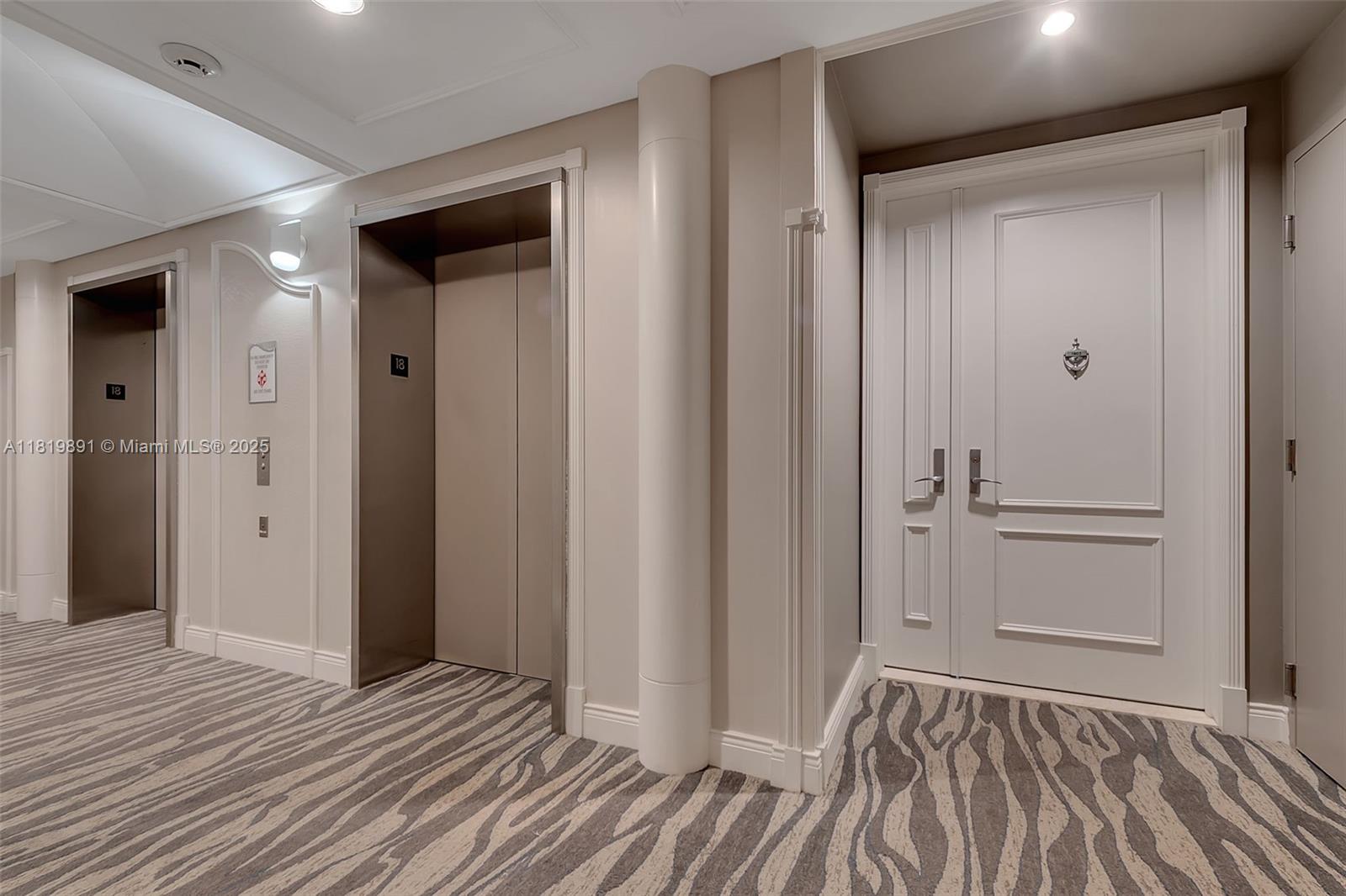 848 Brickell Key Drive, Unit 1803 Miami, FL 33131 - Photo 20 of 25 a view of a room with wooden floor and bathroom