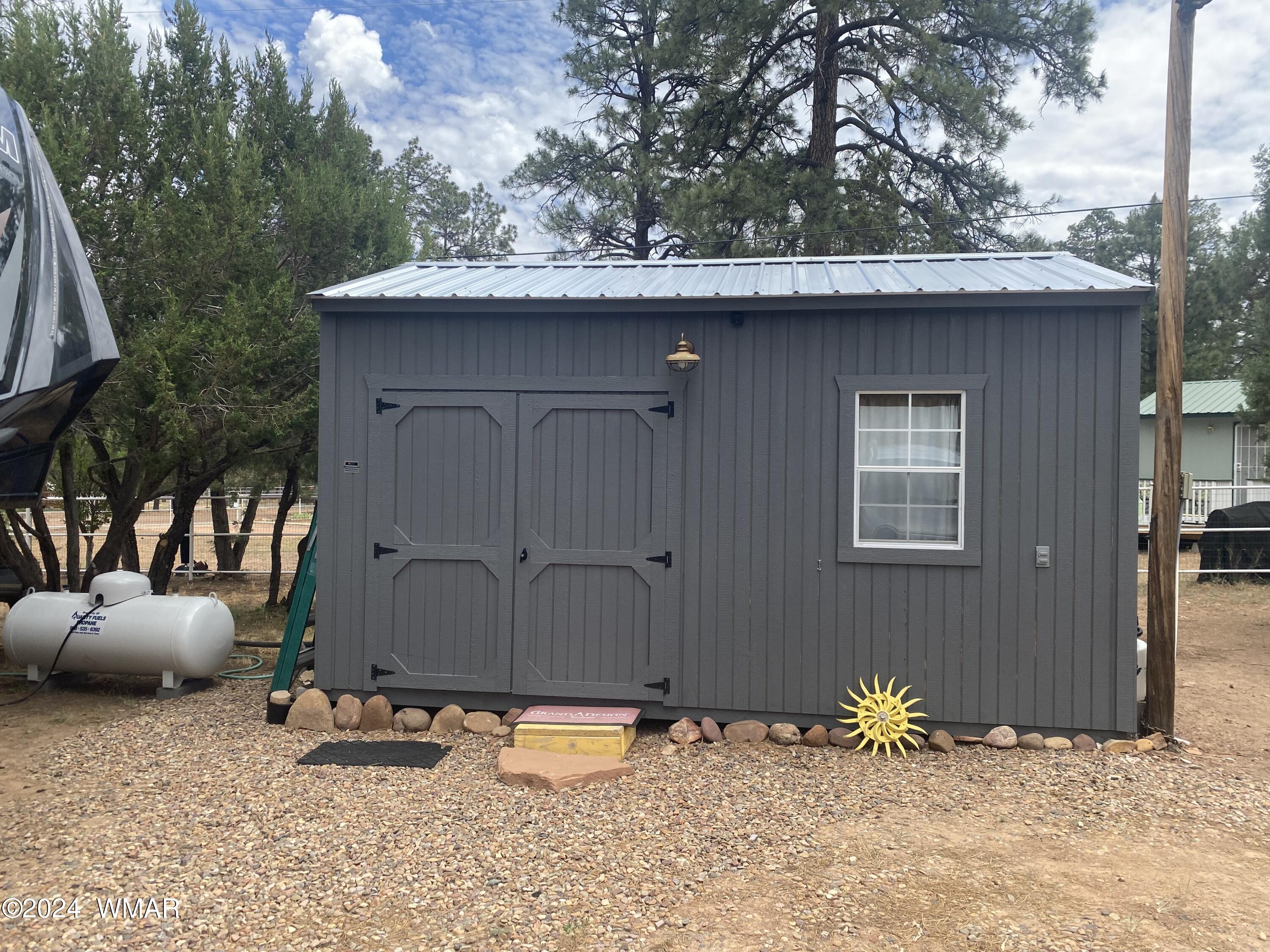 2919 Pine Rim Road Overgaard, AZ 85933 - Photo 6 of 13 a backyard of a house with lots of green space