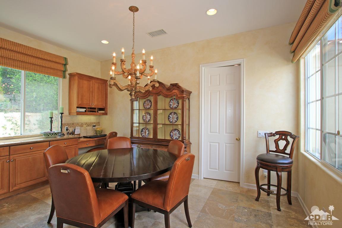 402 Loch Lomond Road Rancho Mirage, CA 92270 - Photo 14 of 30 a dining room with furniture a chandelier and window