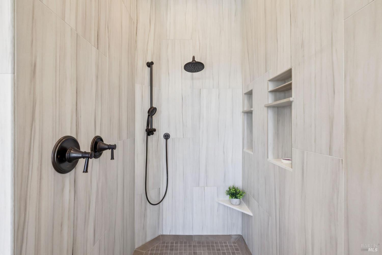 3882 Royal Manor Place Santa Rosa, CA 95404 - Photo 46 of 98 Large walk-in shower with dual shower heads and convenient niches for your shampoo.