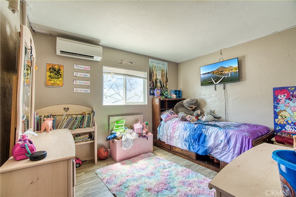 14415 Ridge Road Clearlake, CA 95422 - Photo 12 of 28 a bedroom with bed and a window