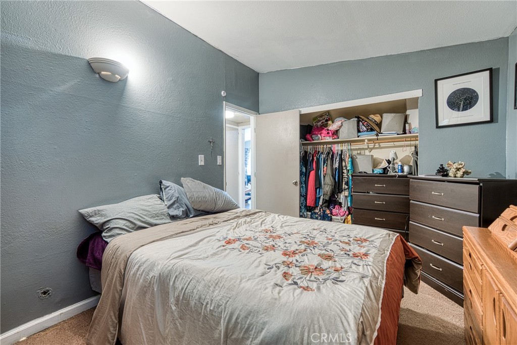 14415 Ridge Road Clearlake, CA 95422 - Photo 16 of 28 a bedroom with a bed and closet