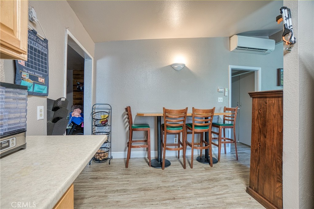 14415 Ridge Road Clearlake, CA 95422 - Photo 21 of 28 a view of a dining room with furniture and wooden floor