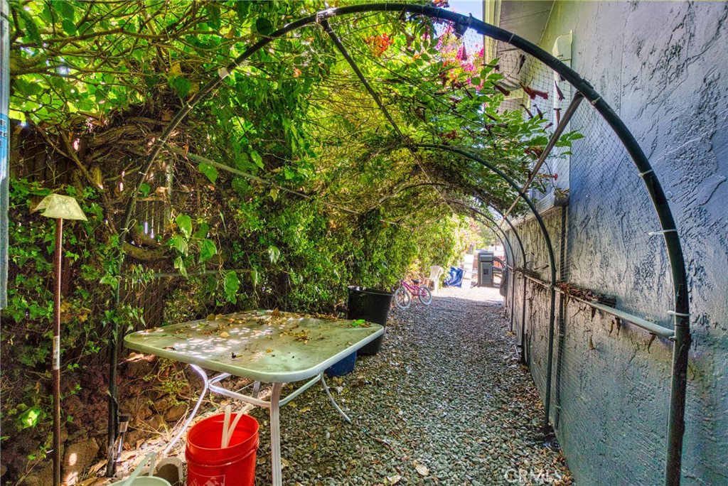 14415 Ridge Road Clearlake, CA 95422 - Photo 26 of 28 a view of a backyard with a table and chairs
