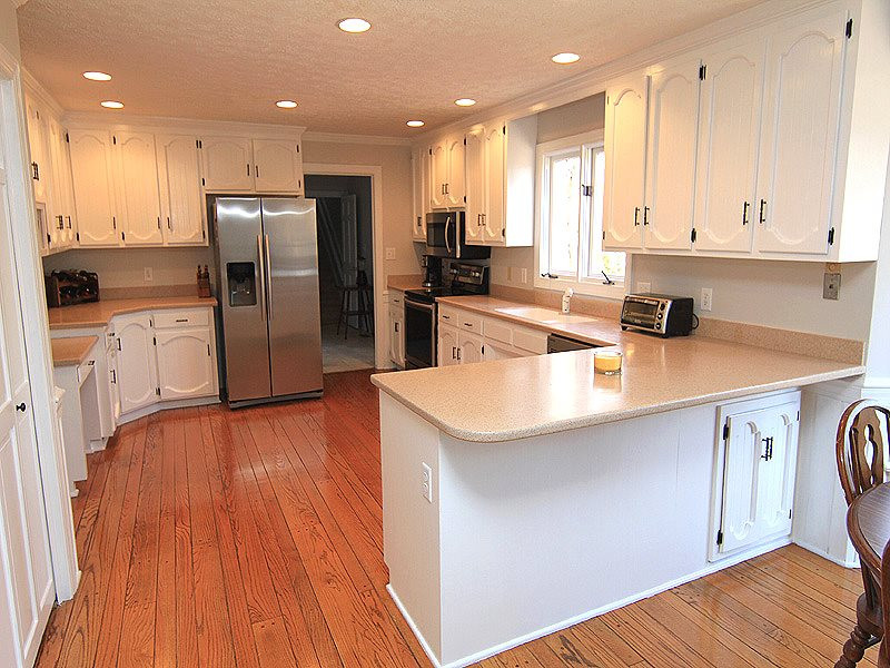 5016 Trail Ridge Drive Raleigh, NC 27613 - Photo 11 of 25 Fantastic kitchen with lots of cabinets, stainless appliances, large pantry, and beautiful wood floors. Kitchen