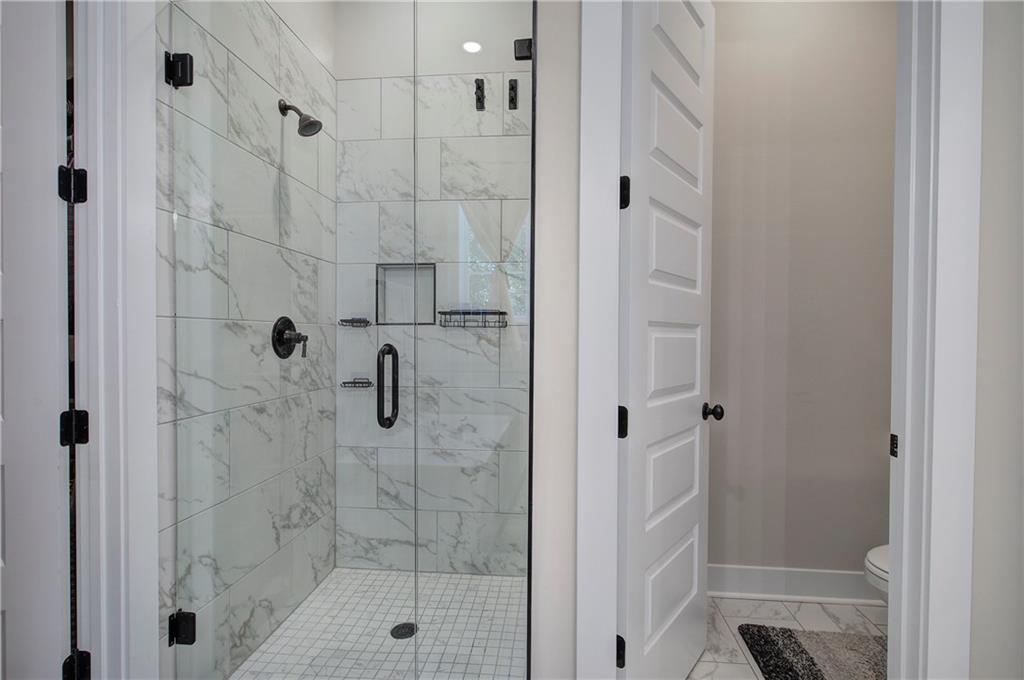 503 London Road Ball Ground, GA 30107 - Photo 26 of 55 a bathroom with a shower