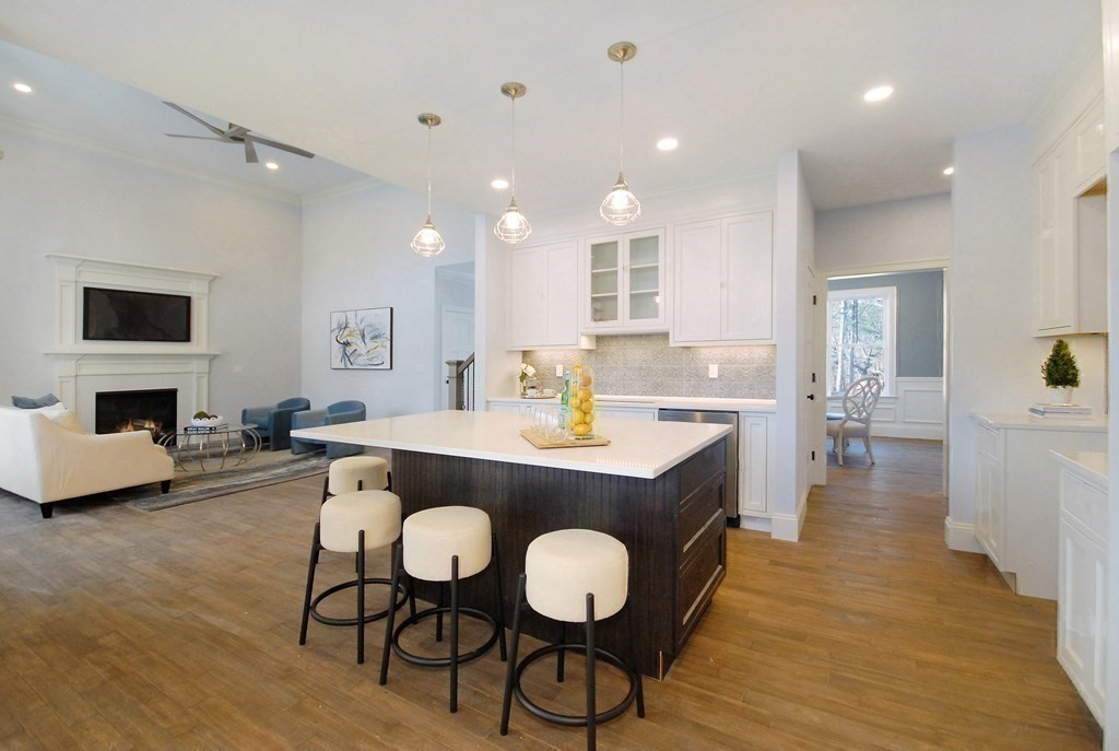 73 Seminole Road Acton, MA 01720 - Photo 16 of 33 a view of a kitchen area with furniture and wooden floor