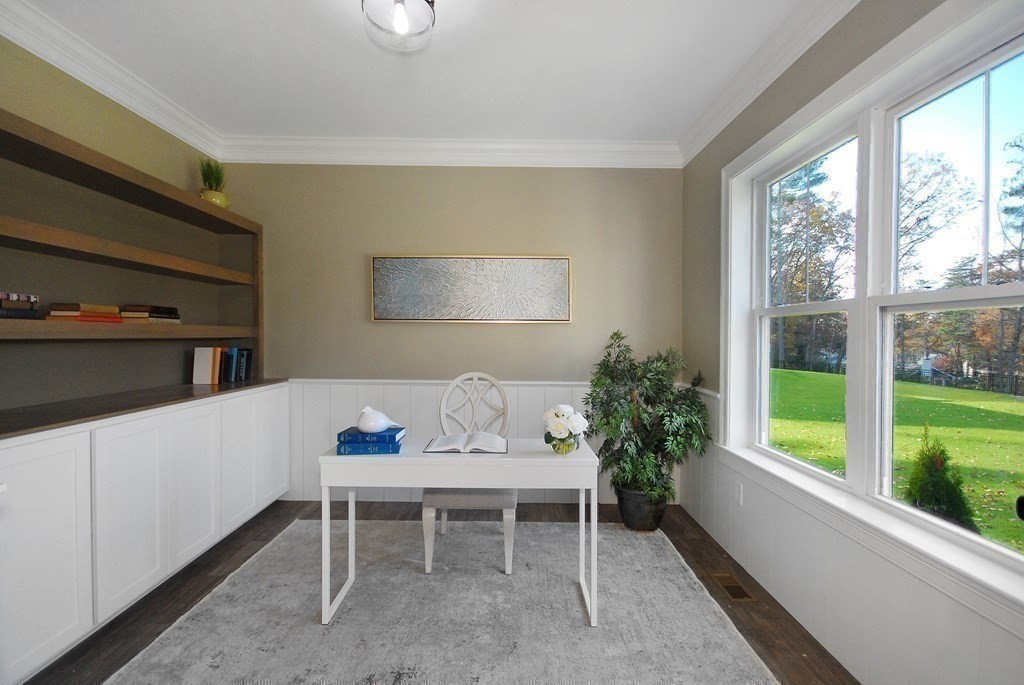 73 Seminole Road Acton, MA 01720 - Photo 21 of 33 a living room with furniture and a potted plant