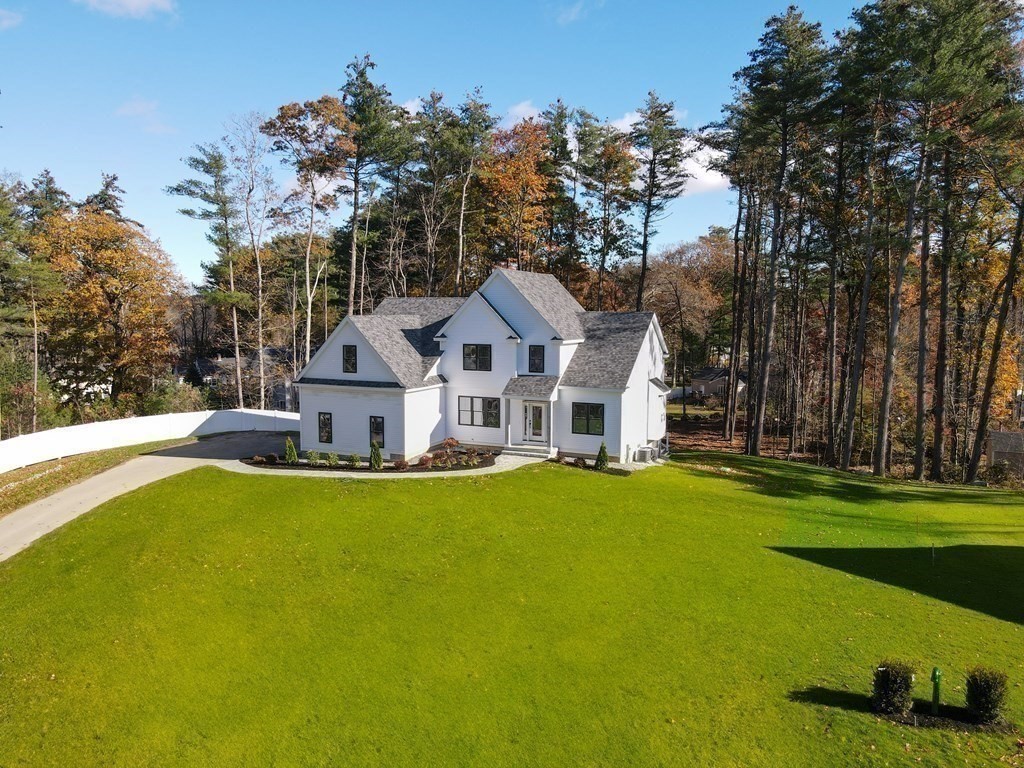 73 Seminole Road Acton, MA 01720 - Photo 30 of 33 a view of a house with a big yard and large trees