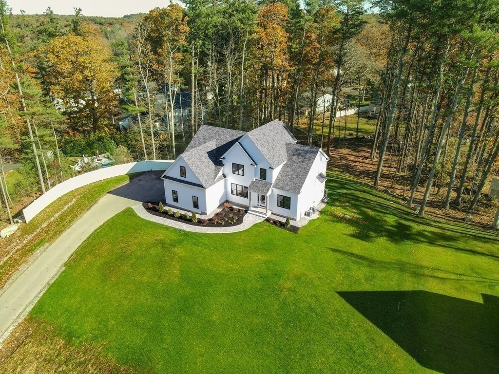 73 Seminole Road Acton, MA 01720 - Photo 4 of 33 a view of a patio with a yard
