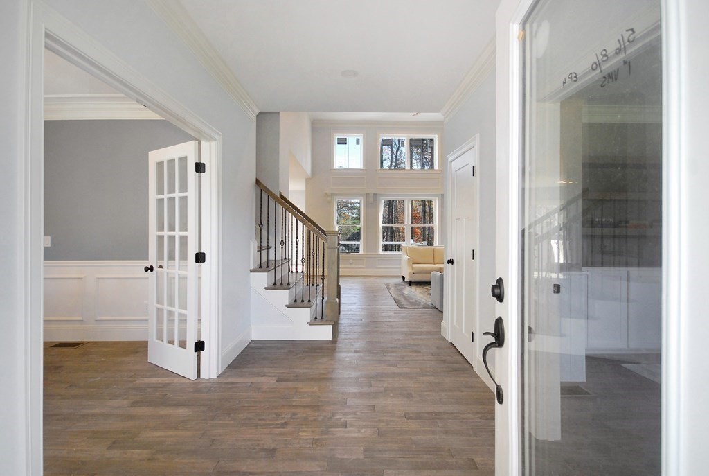 73 Seminole Road Acton, MA 01720 - Photo 6 of 33 a view of a hallway with a livingroom and entryway