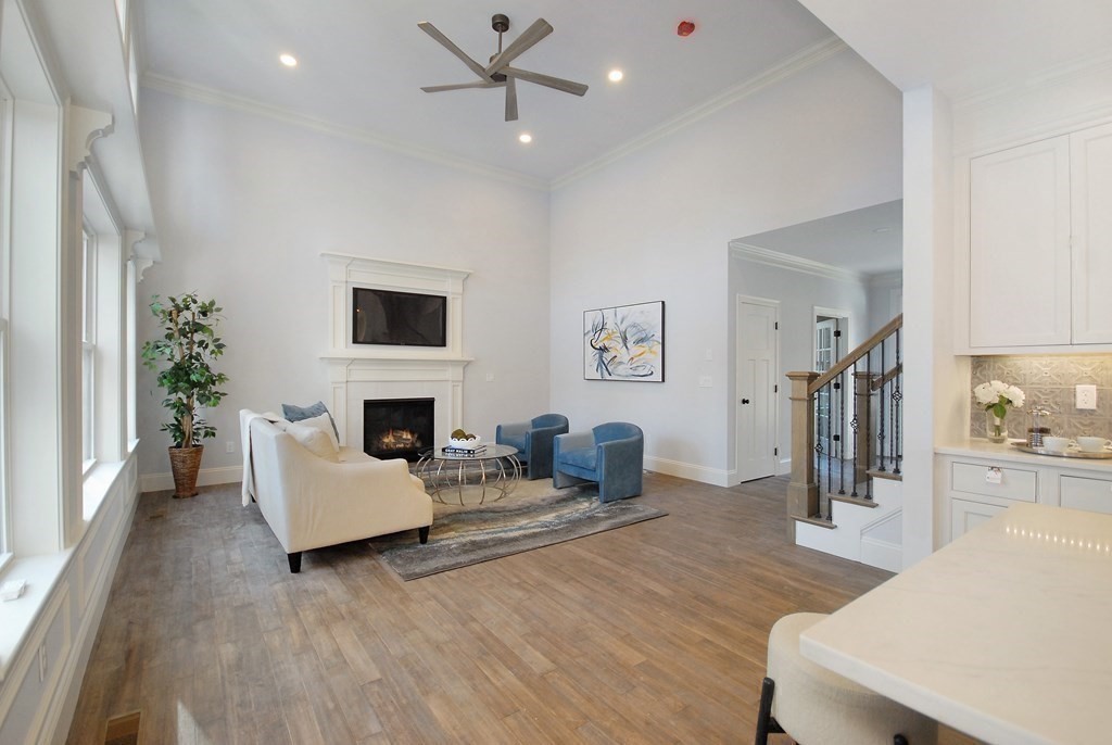 73 Seminole Road Acton, MA 01720 - Photo 10 of 33 a living room with furniture and a fireplace