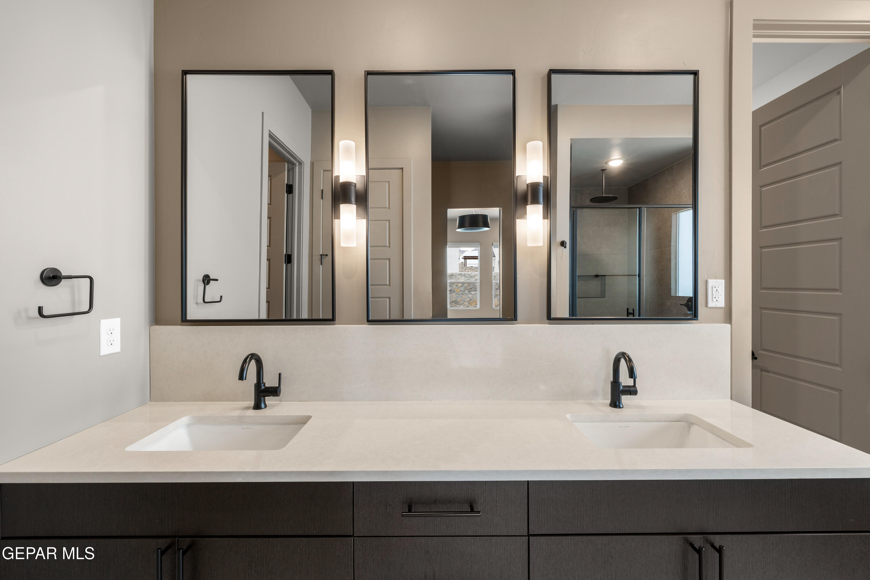 7436 Cimarron Rim Drive El Paso, TX 79911 - Photo 11 of 18 a bathroom with a sink and a mirror