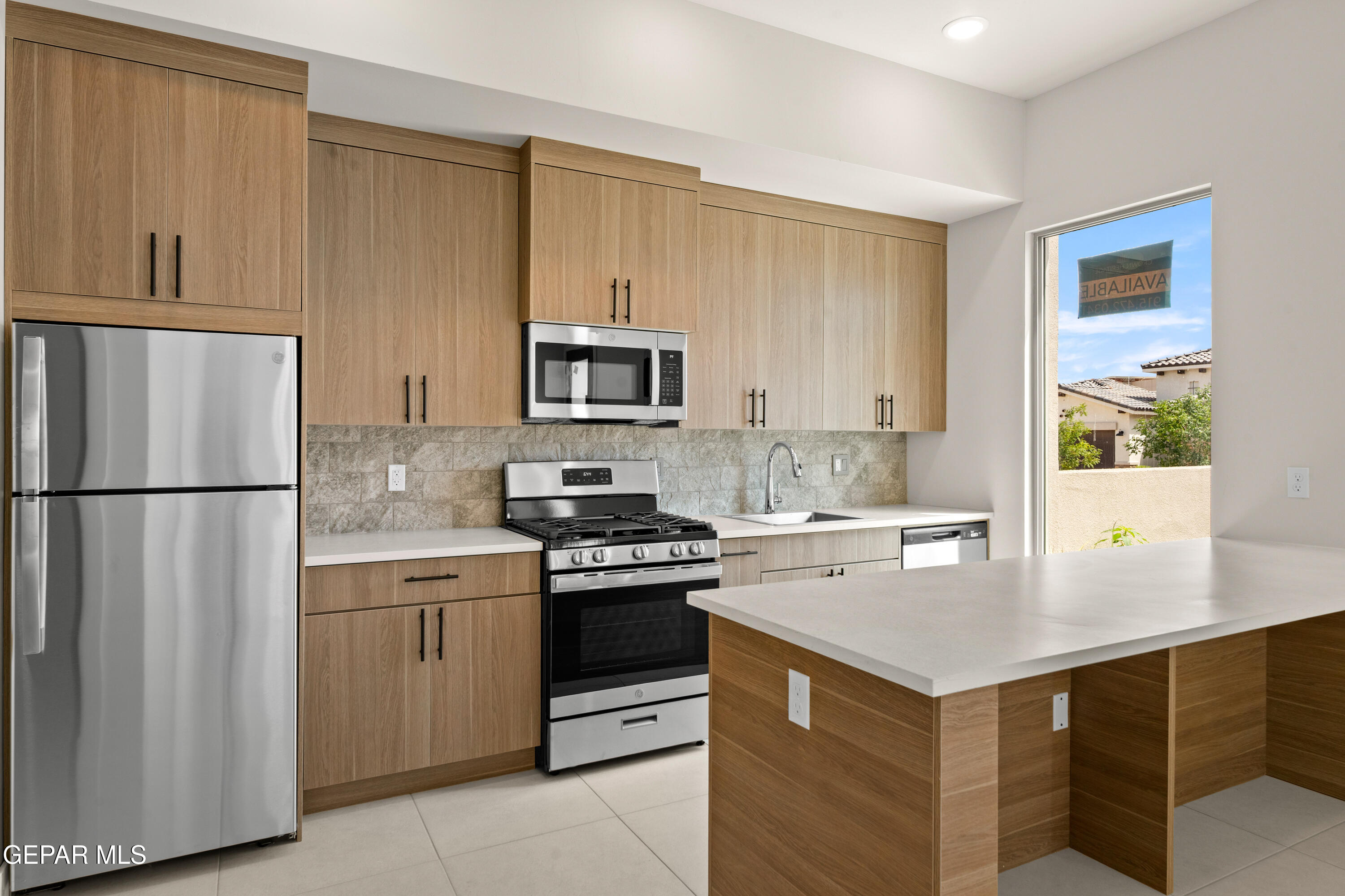 7436 Cimarron Rim Drive El Paso, TX 79911 - Photo 13 of 18 a kitchen with a sink appliances and cabinets