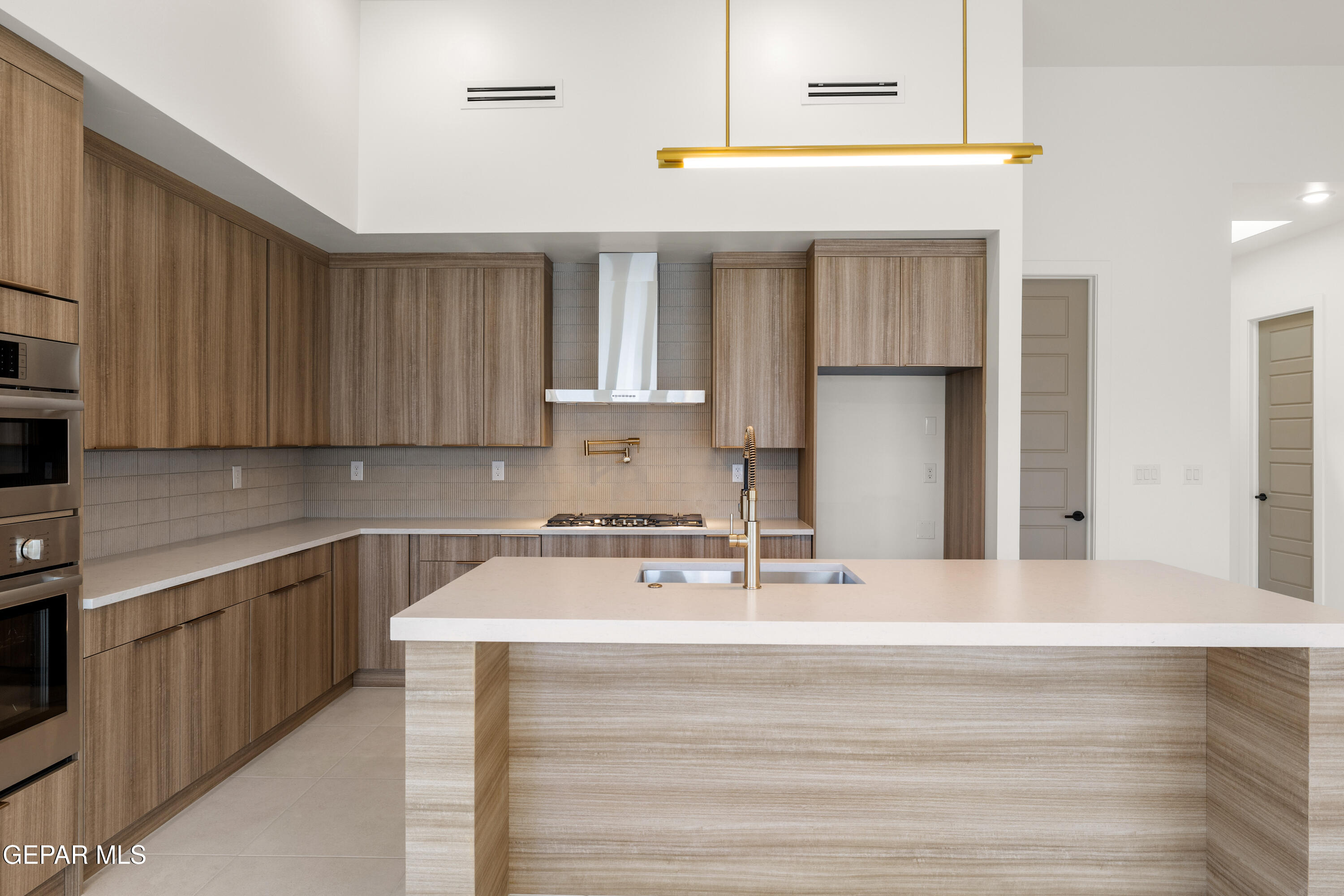 7436 Cimarron Rim Drive El Paso, TX 79911 - Photo 4 of 18 a kitchen with a sink cabinets and appliances