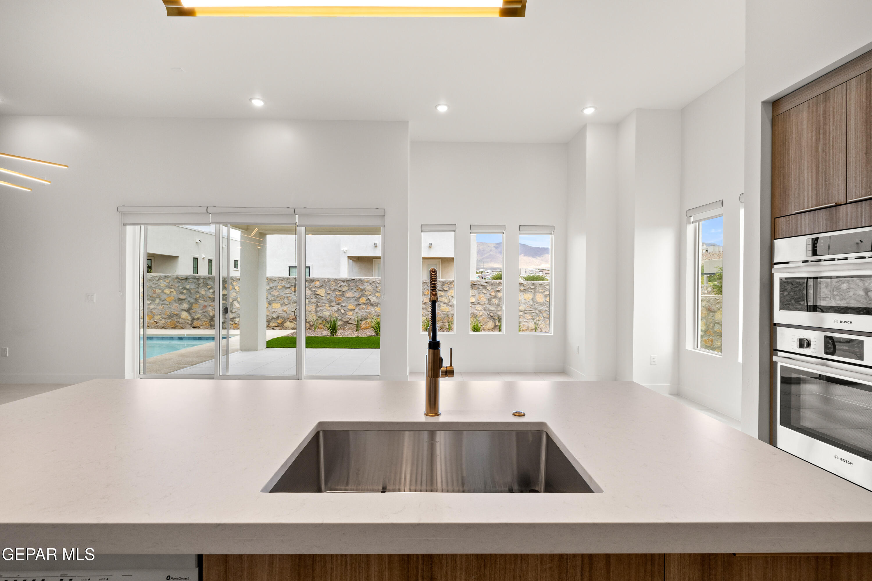 7436 Cimarron Rim Drive El Paso, TX 79911 - Photo 5 of 18 a kitchen with kitchen island a large window in it