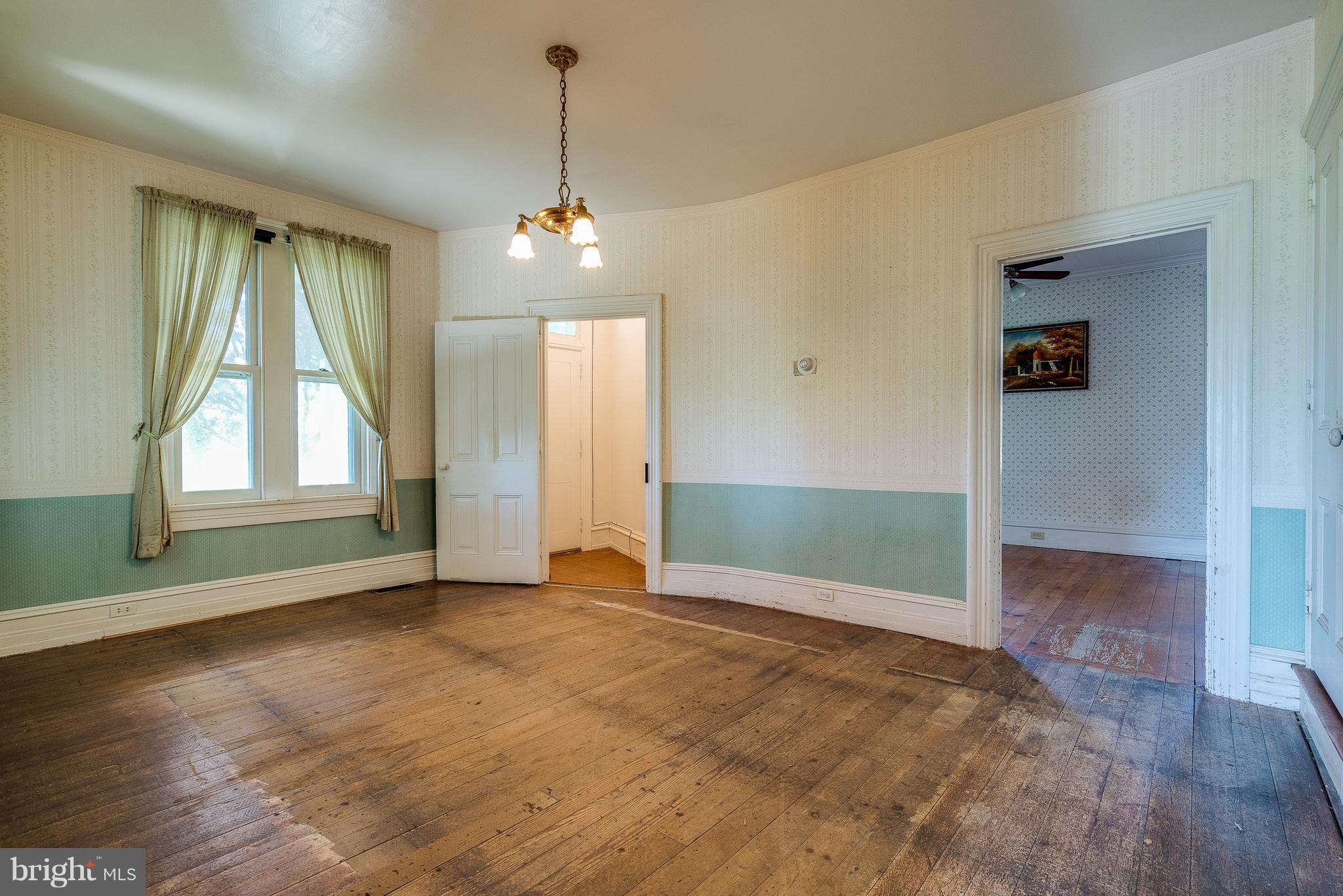 1154 Letort Road Conestoga, PA 17516 - Photo 9 of 44 Dining room with wide trim and wood floors.