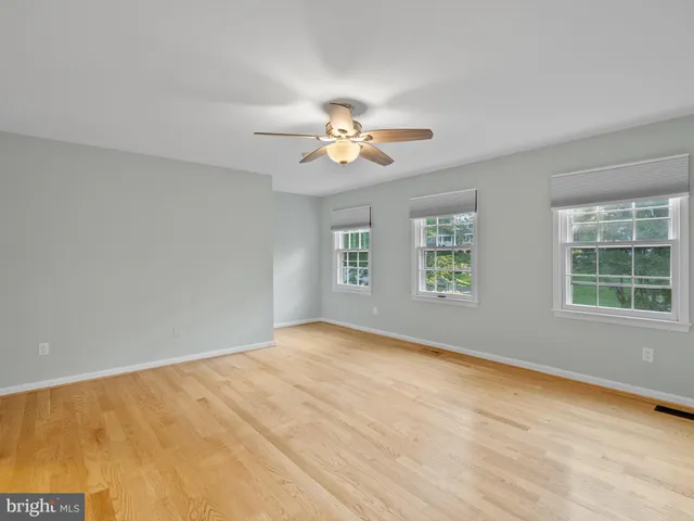 a view of empty room with windows