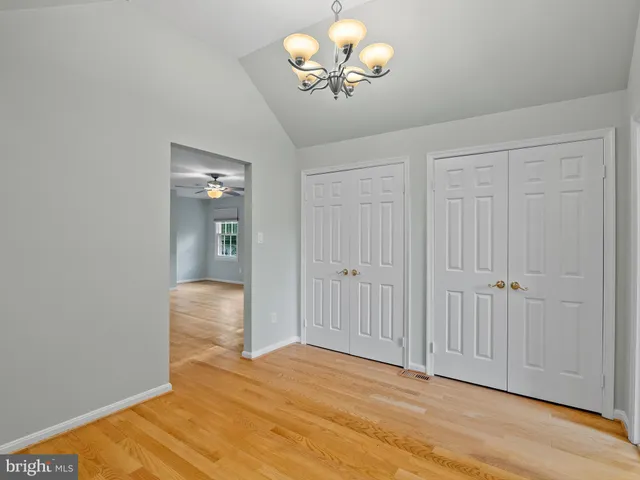 a spacious bathroom with a granite countertop sink and a mirror