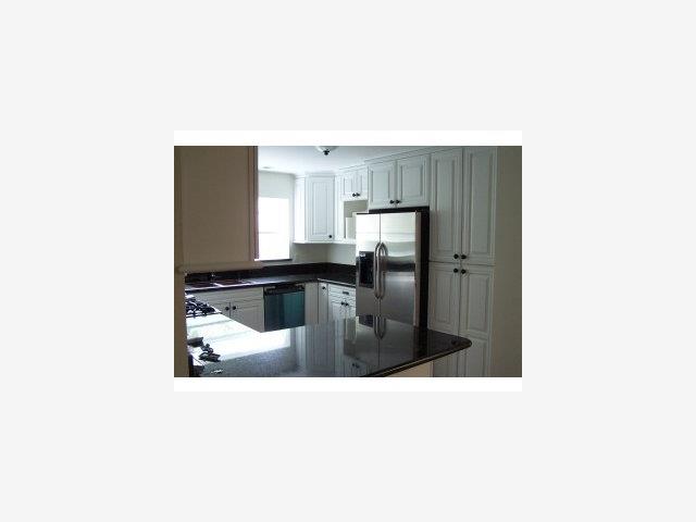 22550 Alcalde Road Cupertino, CA 95014 - Photo 3 of 9 a kitchen with a refrigerator and microwave