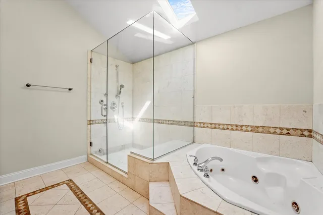 a bathroom with a bathtub and a shower