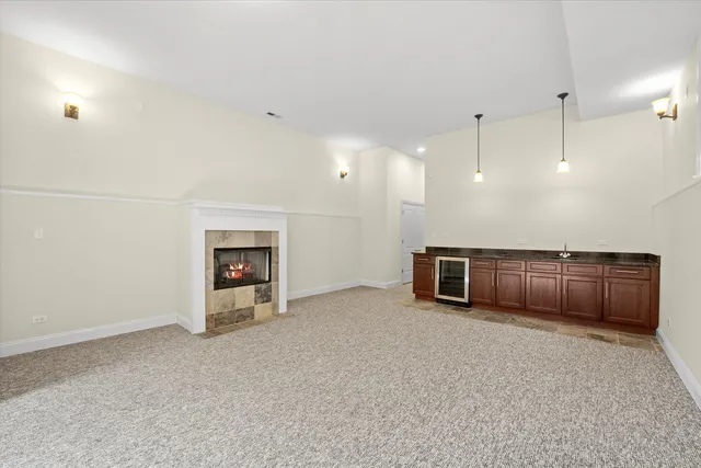 a view of an empty room with a fireplace