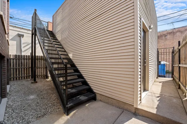 a view of a balcony with wooden door
