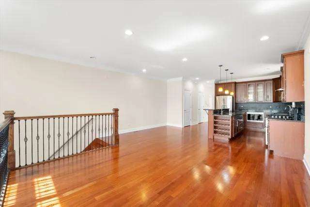 a view of kitchen with furniture and wooden floor