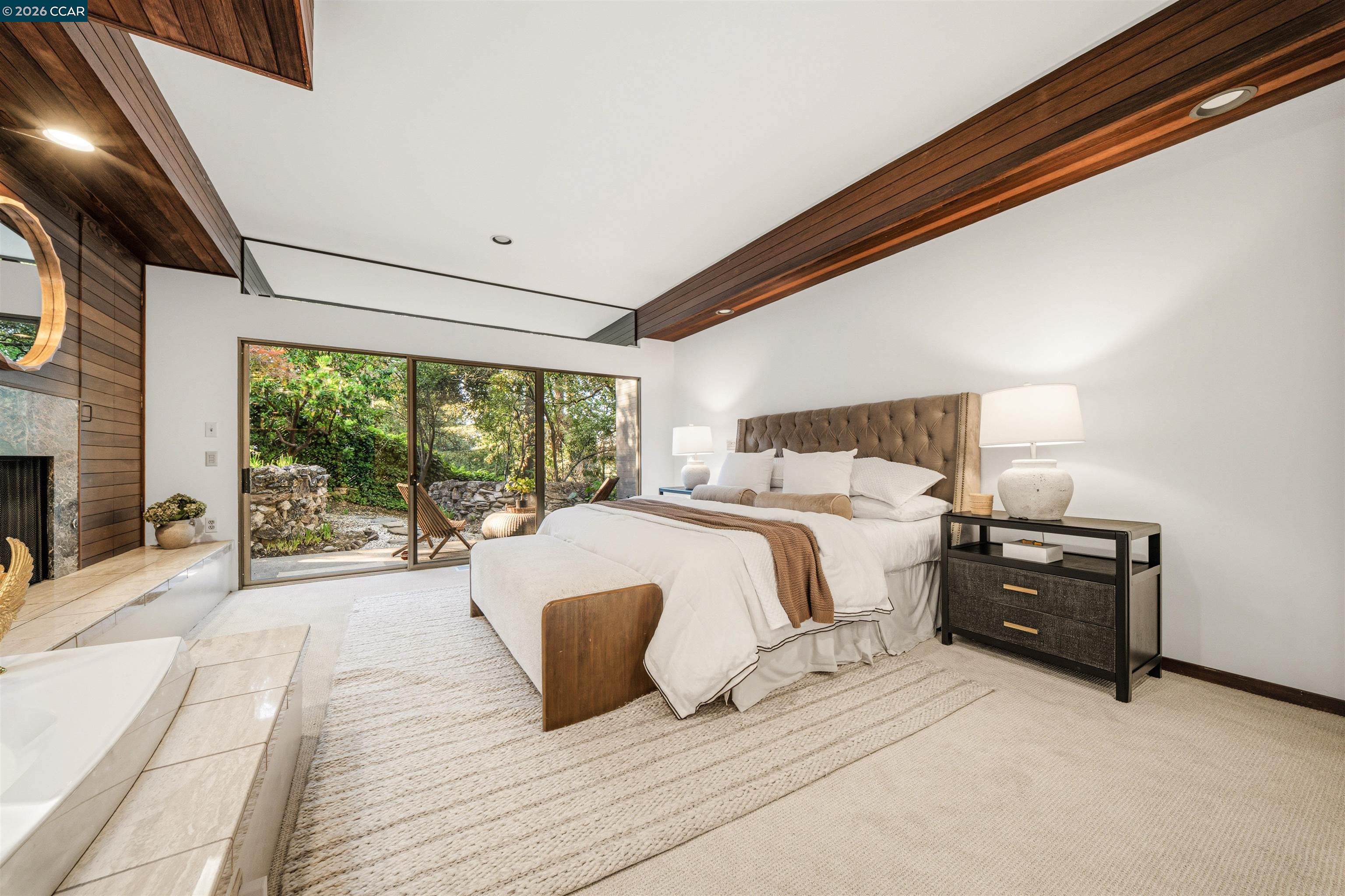 841 Kirkcrest Road Alamo, CA 94507 - Photo 29 of 62 a spacious bedroom with a bed and glass door