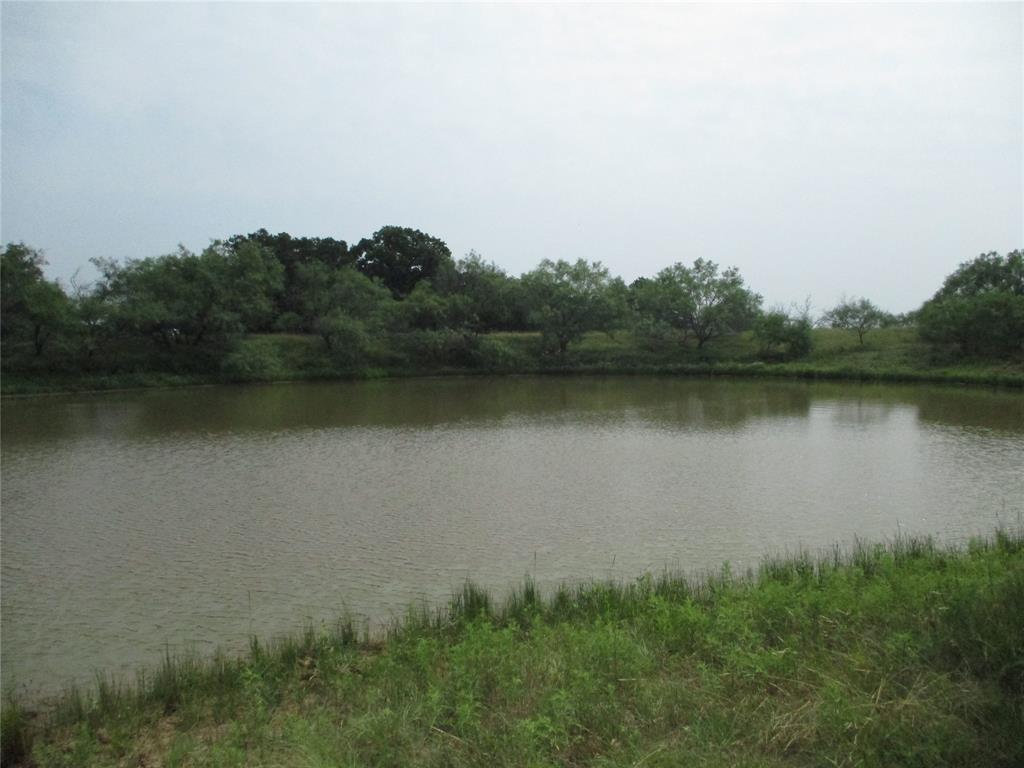 an aerial view of mountain with lake view