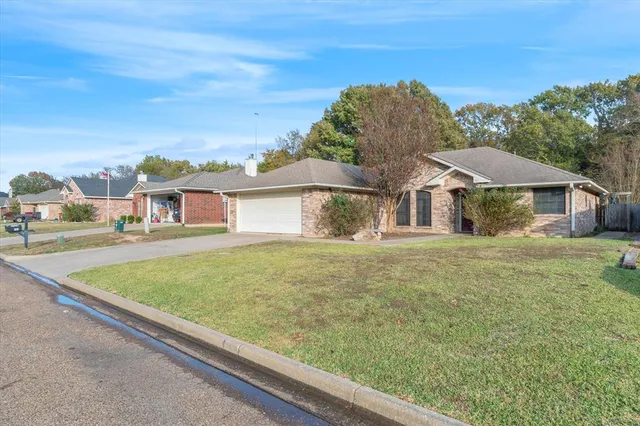 an aerial view of a house with swimming pool