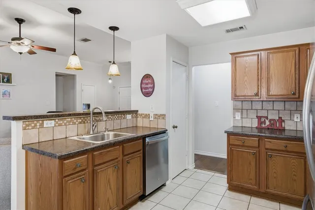 a kitchen with a sink cabinets and window