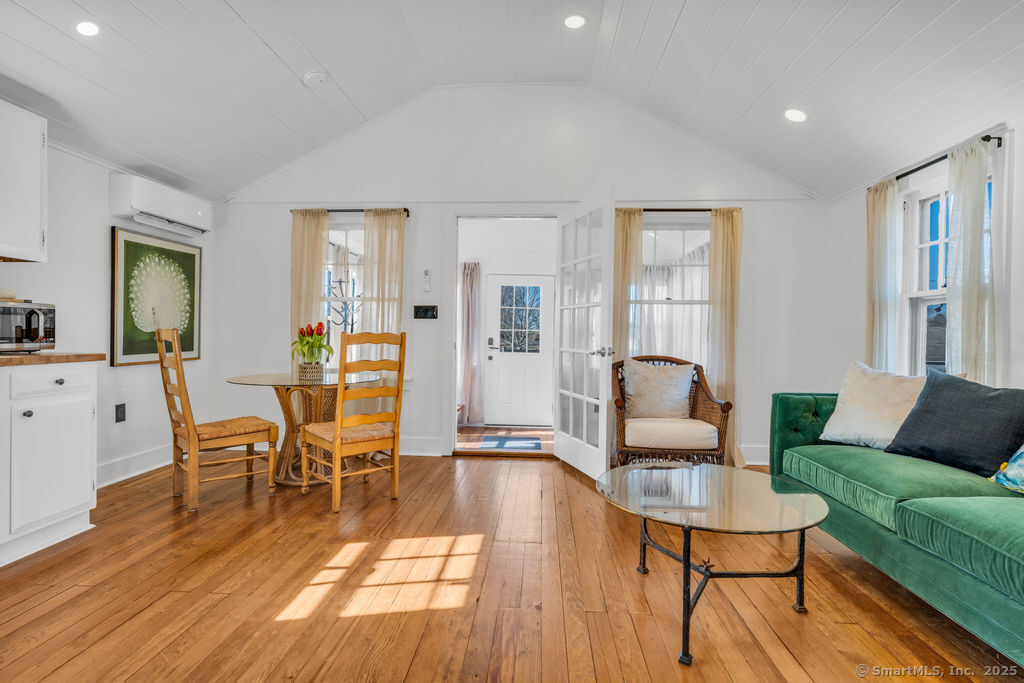 69 Waterside Lane, Unit 2 Clinton, CT 06413 - Photo 12 of 14 a living room with furniture and wooden floor