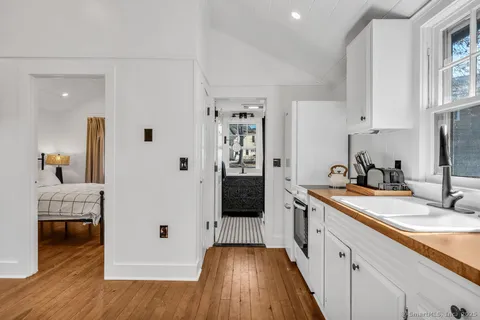 a spacious bathroom with a sink and a mirror