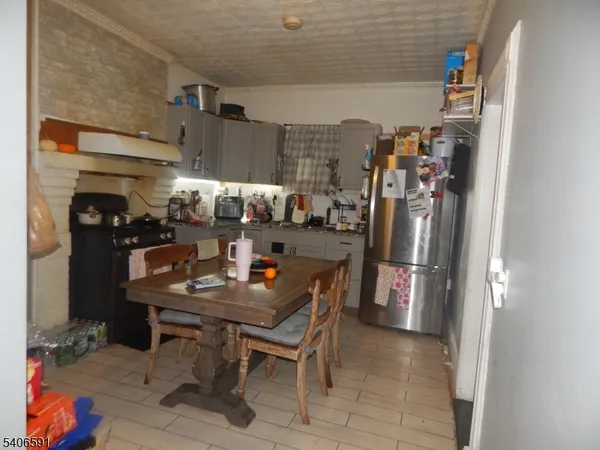 a dining room with furniture and a kitchen view